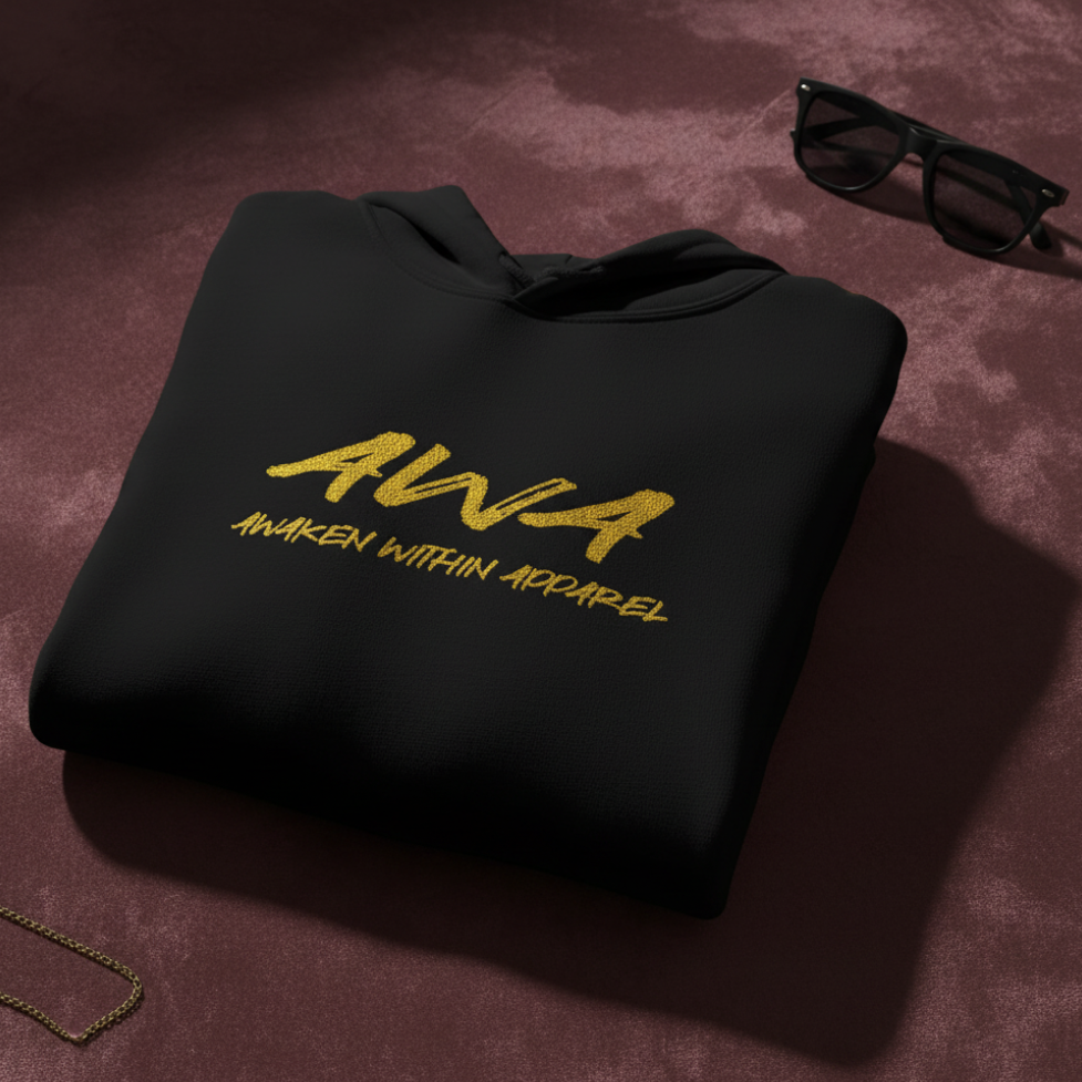 Black AWA hoodie folded on burgundy velvet