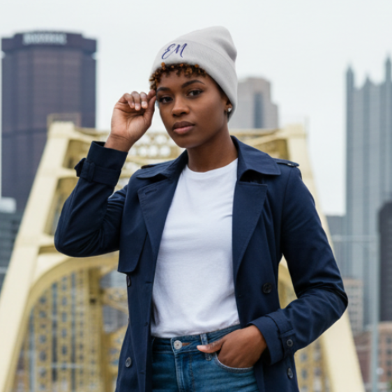 Female model in white Elevated Minds beanie
