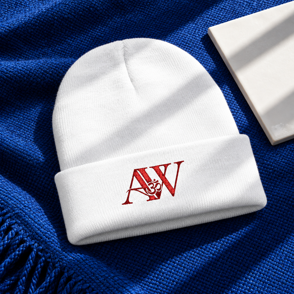 White AWA beanie folded on cobalt blanket
