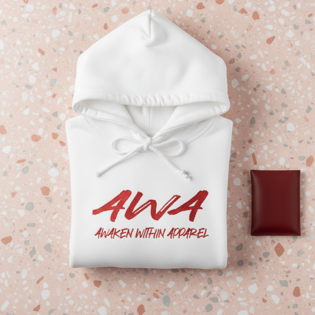 White AWA hoodie folded on terrazzo